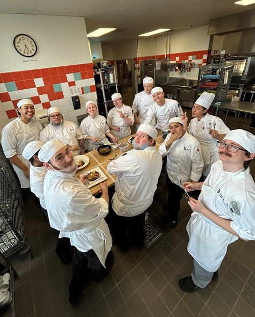 Sustainable Food Systems students gathered around table in kitchen