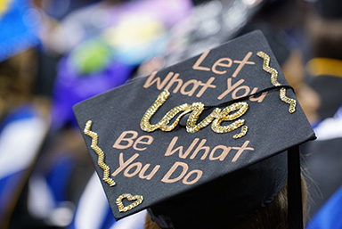 Graduation cap that reads "Let what you love be what you do"
