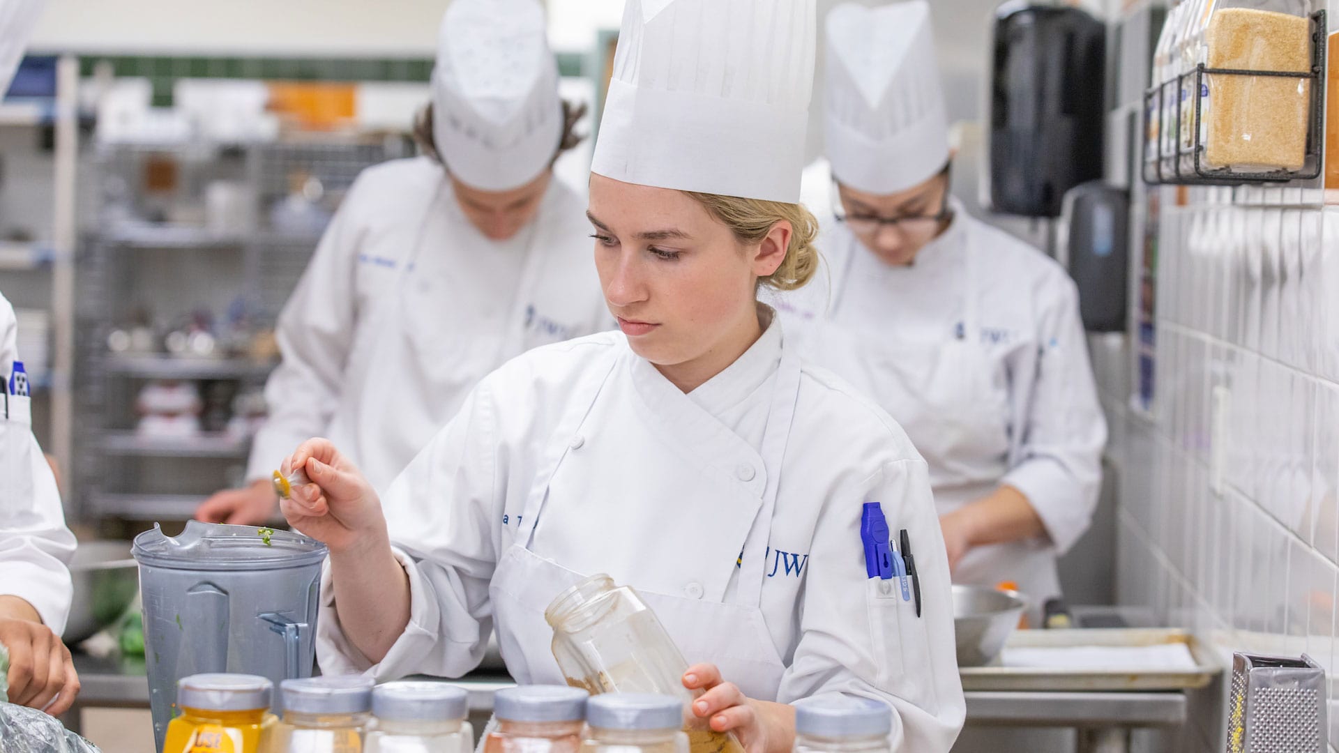 Nutrition student at work in the Vegetarian Cuisine class, which explores the benefits of plant-forward diets.