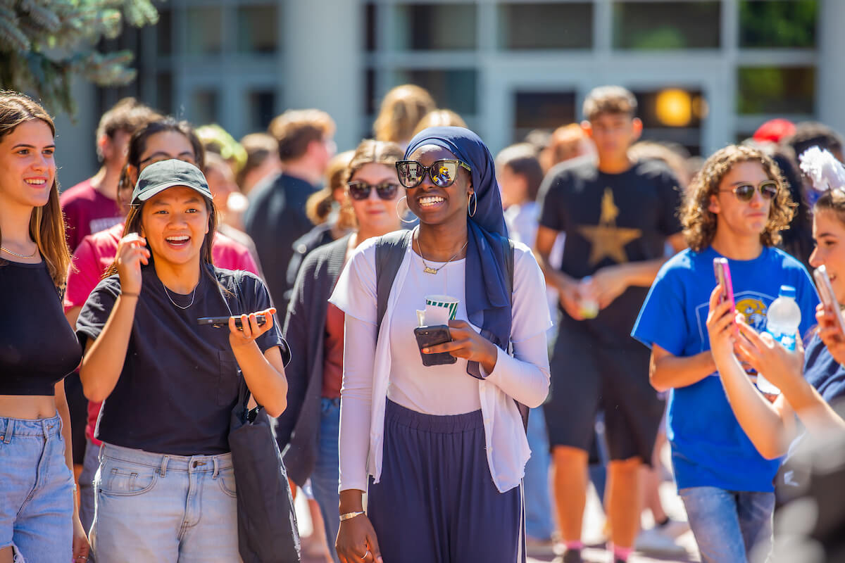 smiling students outside at JWU Providence campus
