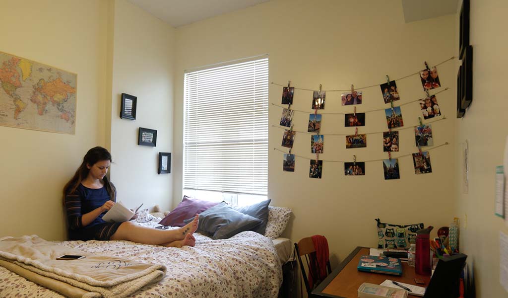 JWU student studying in a residence hall