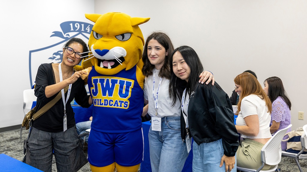international students with wildcat willie