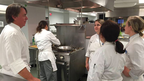 JWU culinary nutrition interns working with John Besh at a Tulane fundraiser.