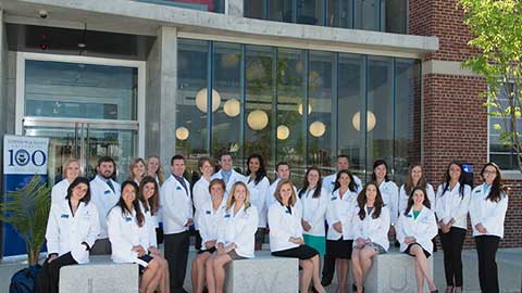 Physician assistant students in front of JWU's Center for Physician Assistant Studies
