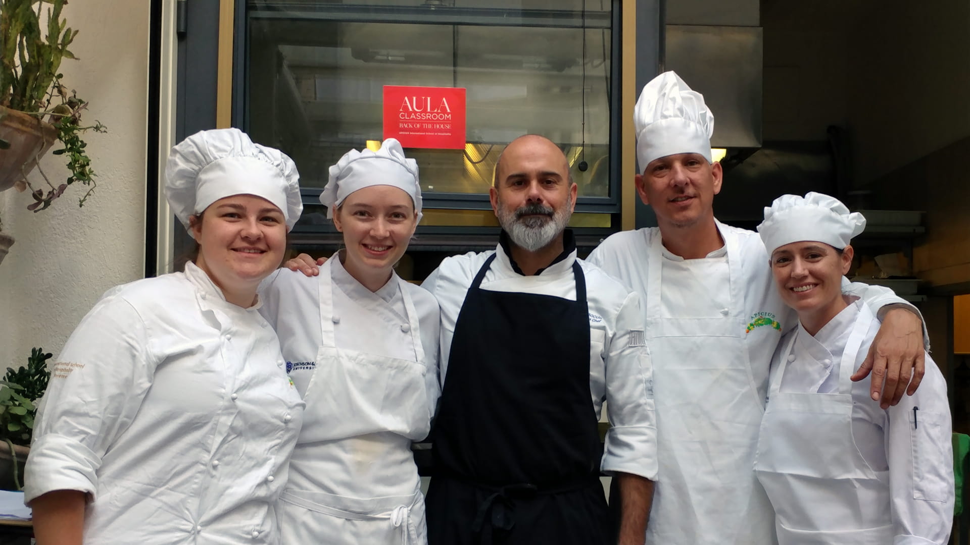 JWU Denver student Kenny Sargent in Italy with fellow JWU students Sarah Hegge, Cora Gaines and Kate Ethridge. (Chef Massimo Bocus in the center.)