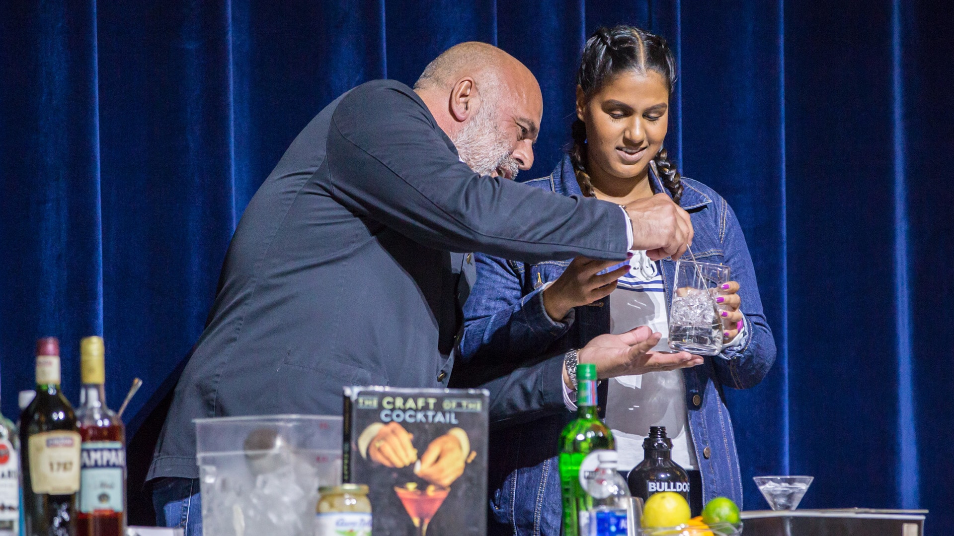Tony Abou-Ganim demonstrates to JWU student how to mix a cocktail.