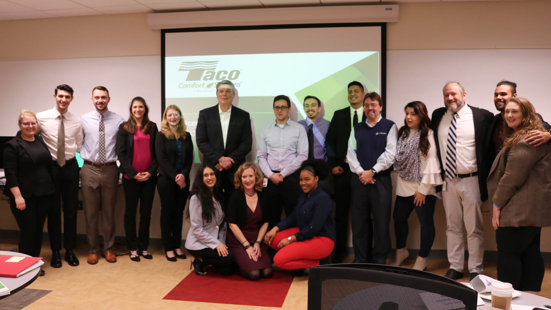 Group shot of JWU marketing students and Taco executives