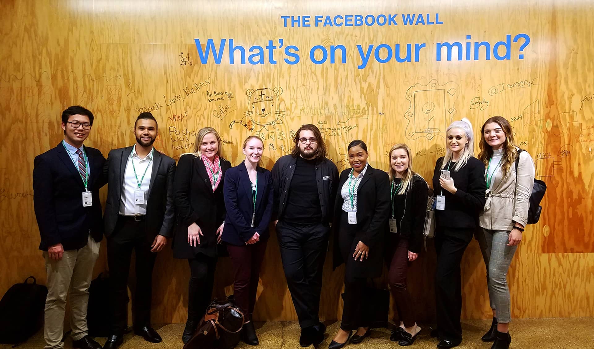 JWU Students in front of The Facebook Wall: What's on Your Mind?