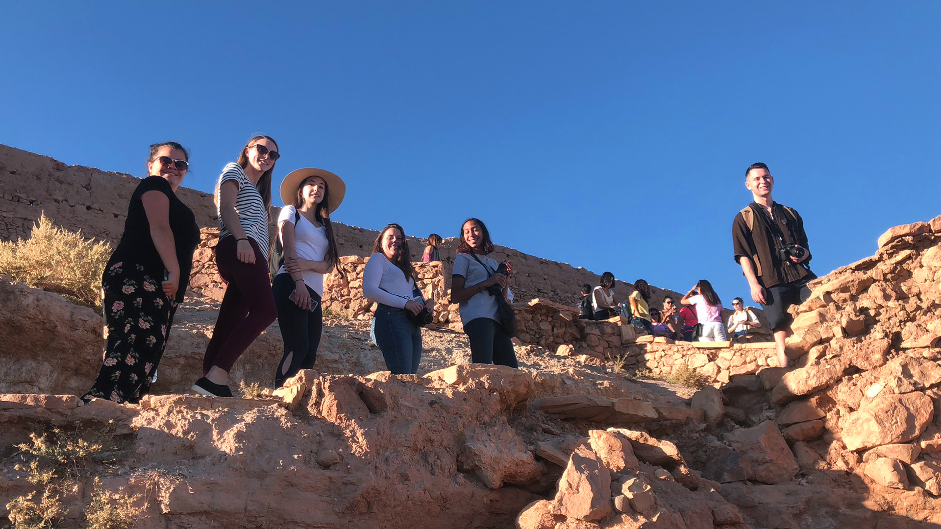 A group of students on rocks.
