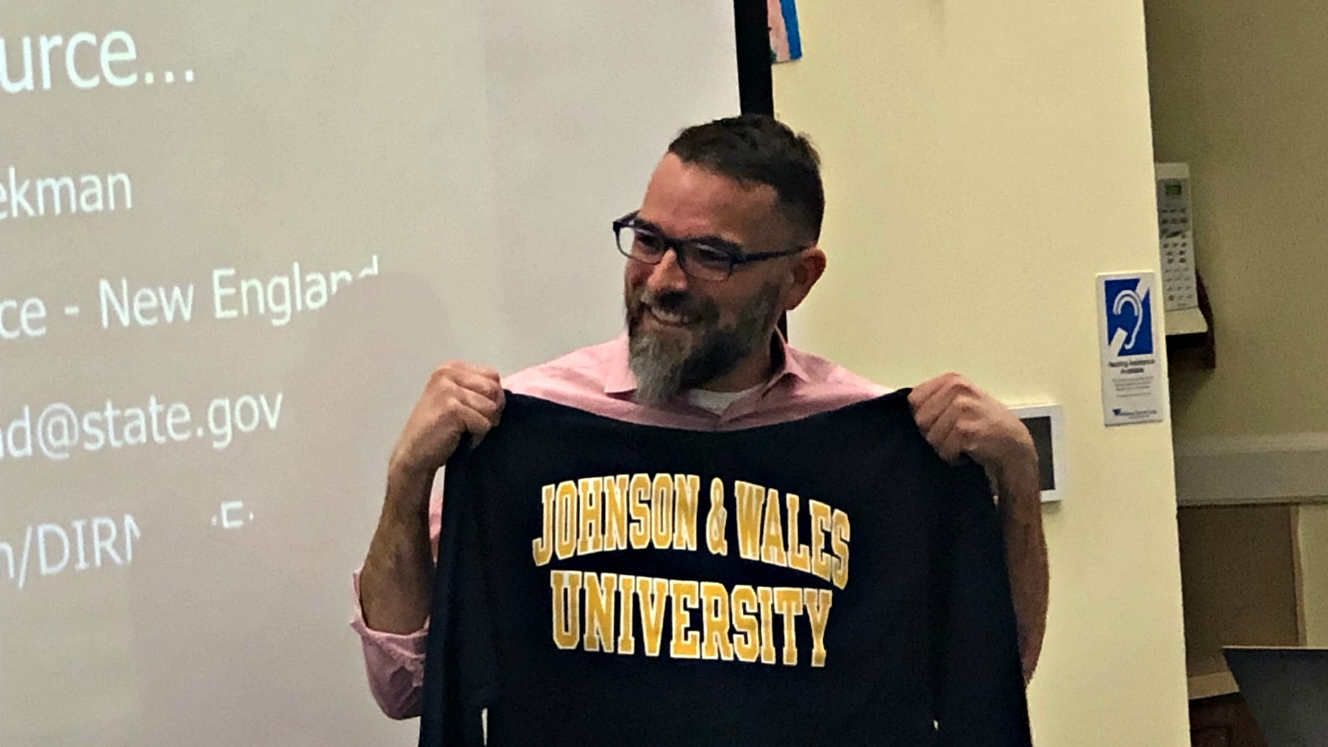 Students gave Philip Beekman a JWU sweater.