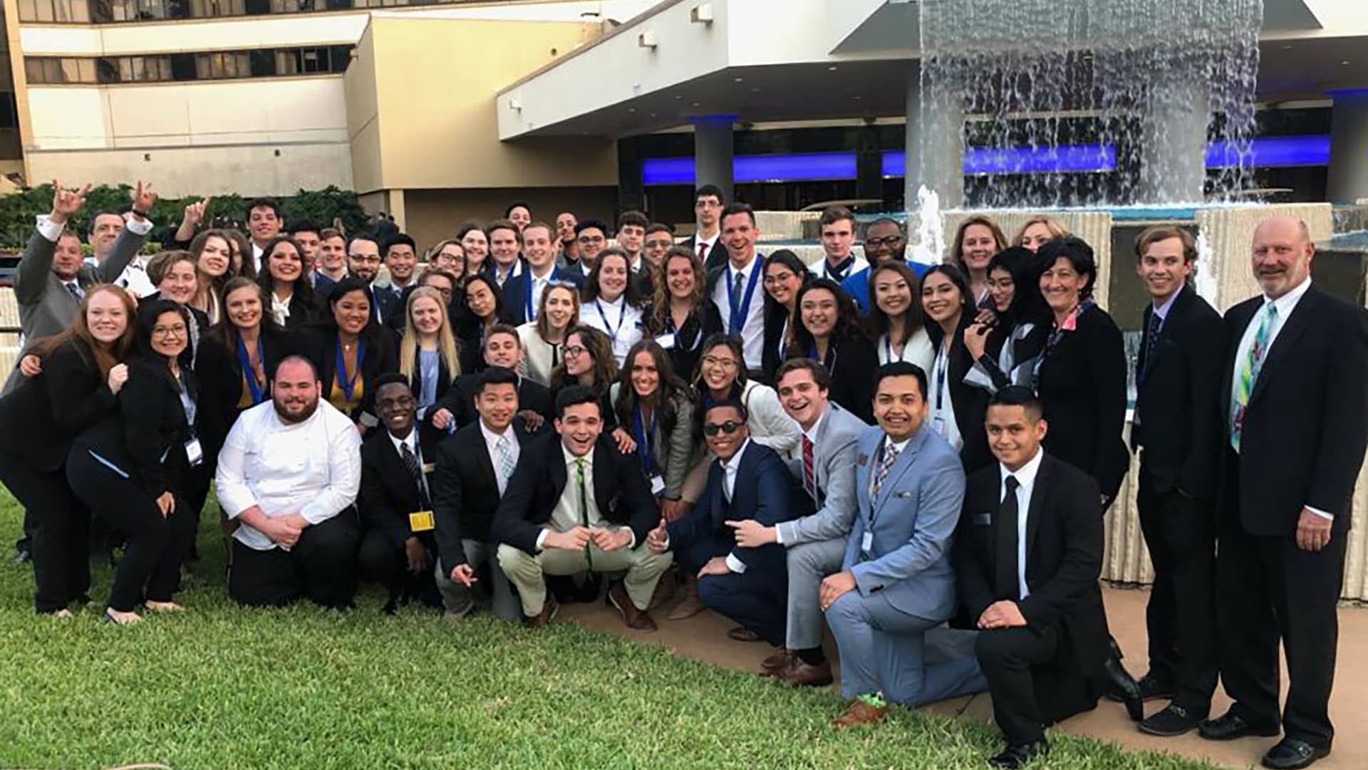 full DECA group shot in front of fountain