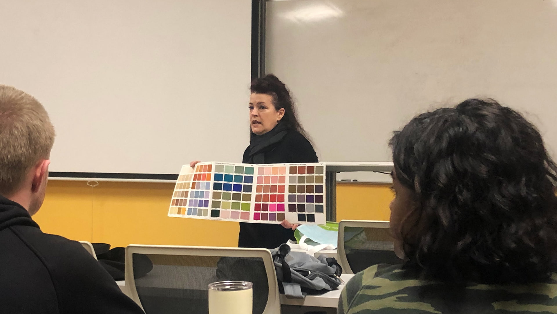 Harper Della-Piana speaking to a class.