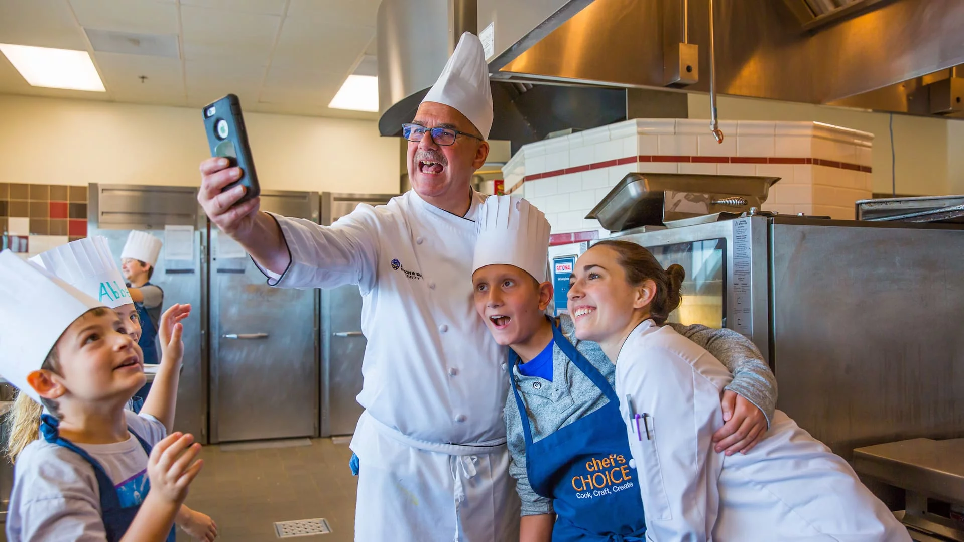 Chef Dion takes a selfie with campers.