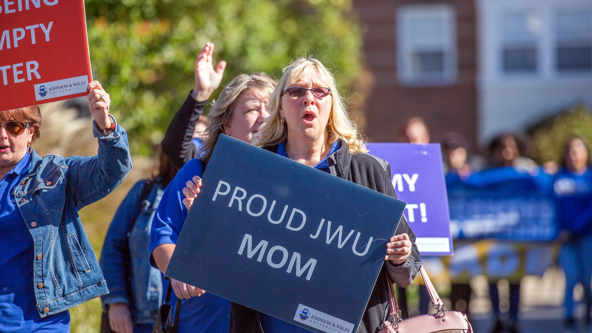Proud JWU Mom walking in the annual Homecoming and Family Weekend parade. 