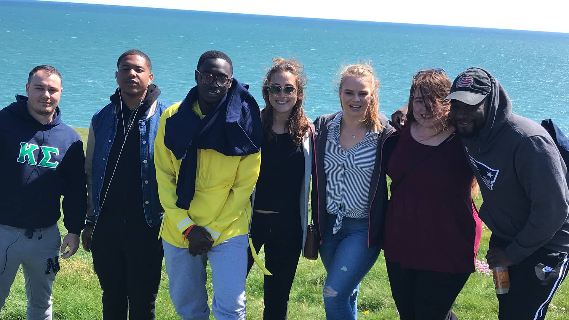 a group of students at the Cliffwalk of Dunmore in Ireland