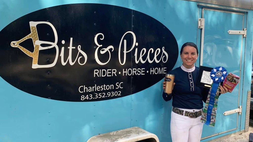 Tierney Boyd poses in front of her Bits & Pieces horse show trailer
