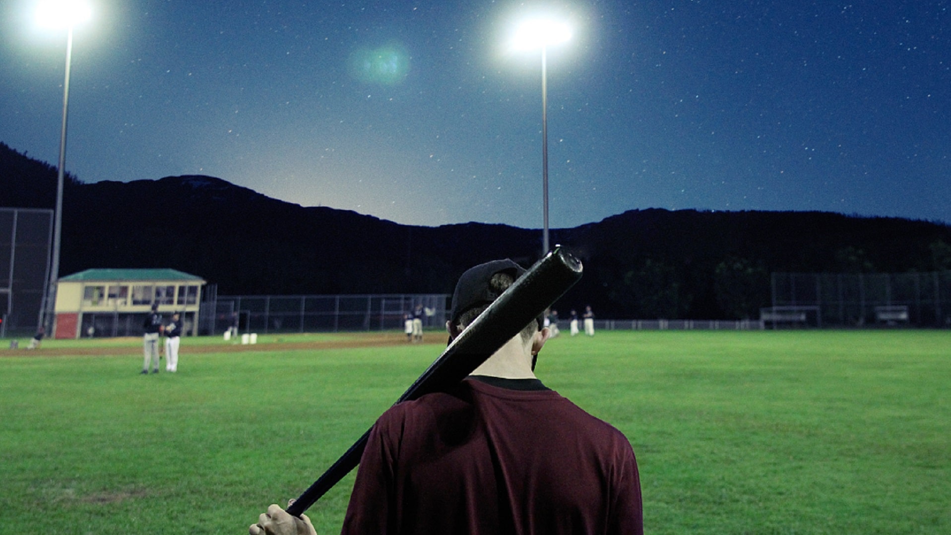 baseball player in field at night