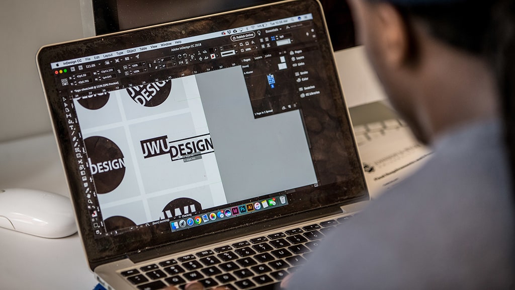 Student creating JWU Design logo
