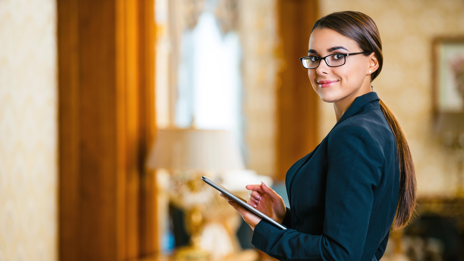 Female hotel manager in hotel lobby