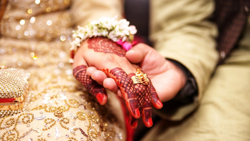 Hands with henna at Indian wedding