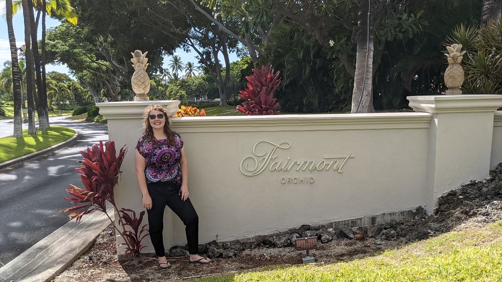 America Mason in front of Fairmont Orchid sign
