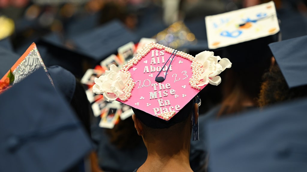 Mortarboard decorated with the phrase, “It’s all about the mise en place.”