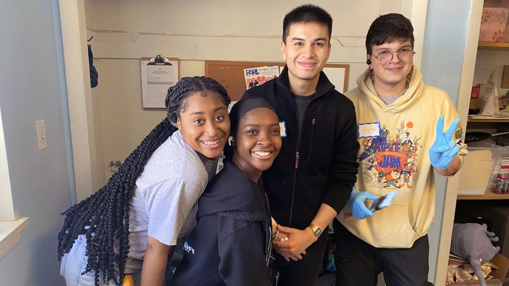 JWU student volunteers at Providence Animal Rescue League (PARL). 
