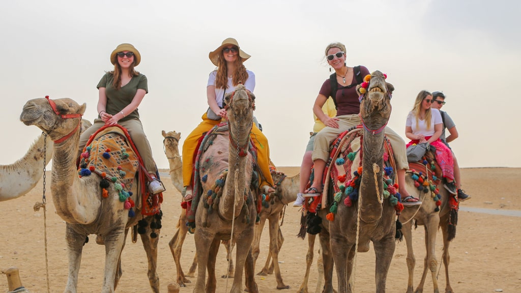 Students in Egypt riding Camelback