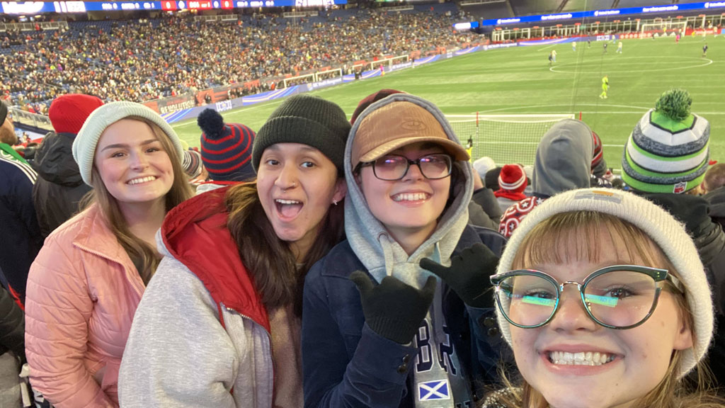 Miranda with friends at a soccer game