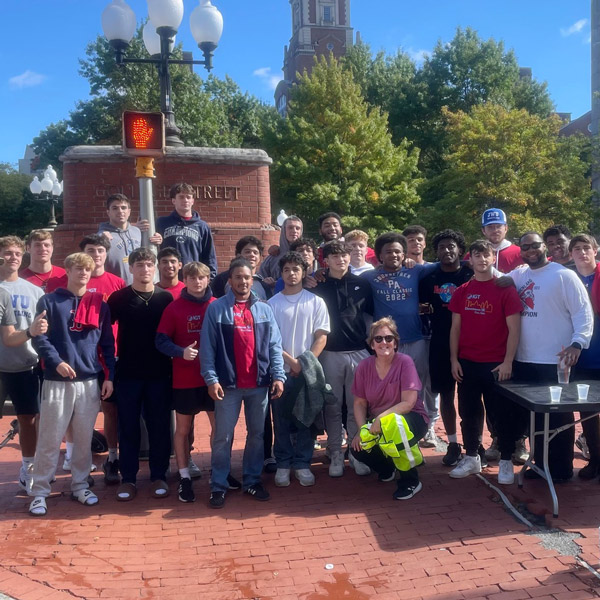 a group photo taken on a sidewalk in Providence