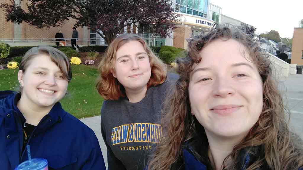 Emma Lipinski '24, center, with some JWU peers in front of the Wildcat Center