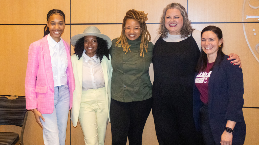 group photo of JWU alumnae panelists from March 2025