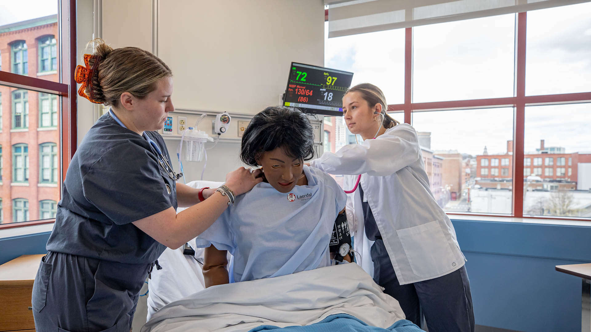 Nursing students in the ABSN program work with high-fidelity mannequins in the Sim and Practice Labs.