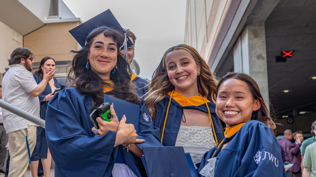 A trio of undergraduates outside the Amica Pavilion. 