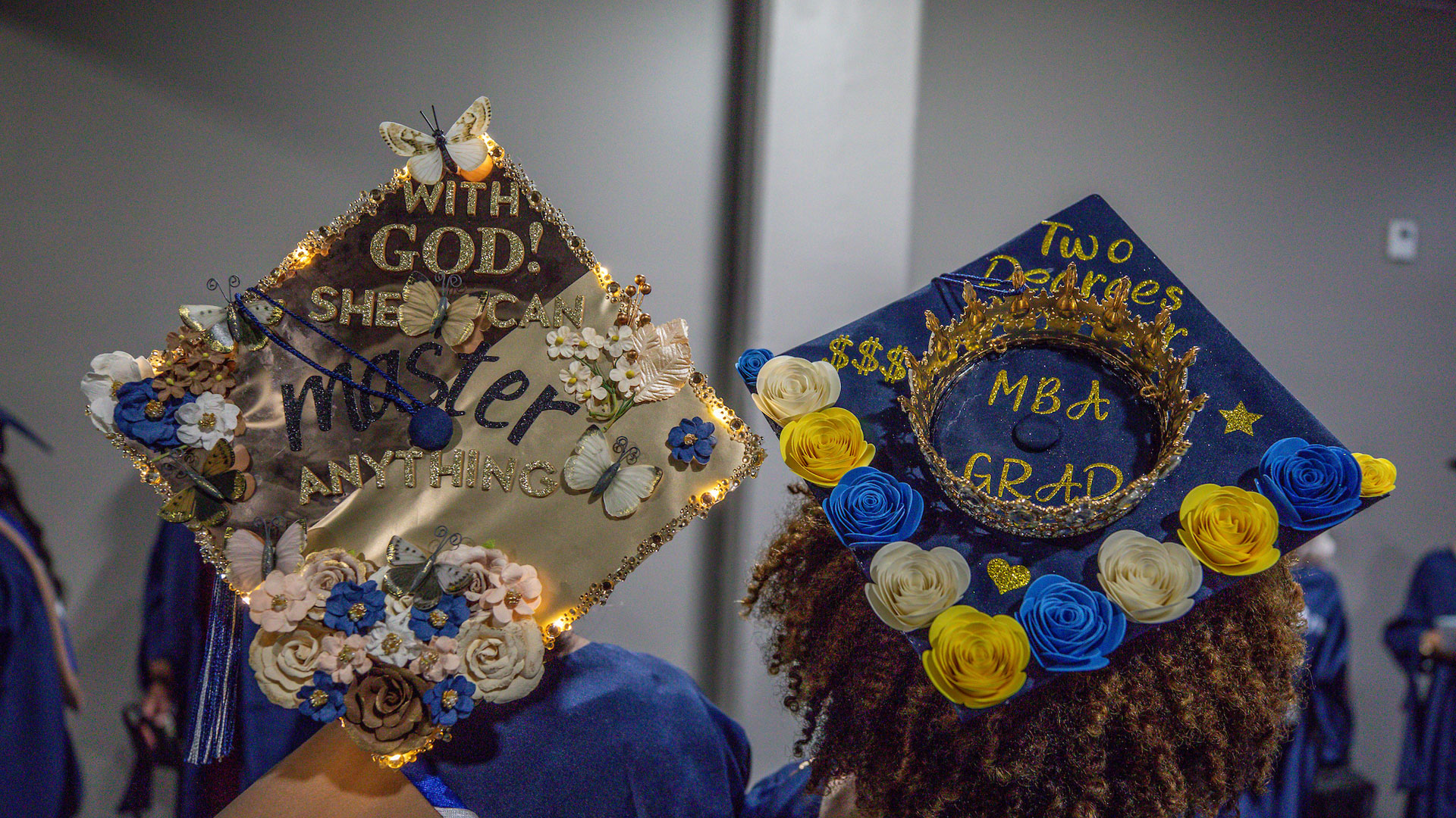 Two decorated mortarboards from the 2025 Providence Commencement ceremony. 
