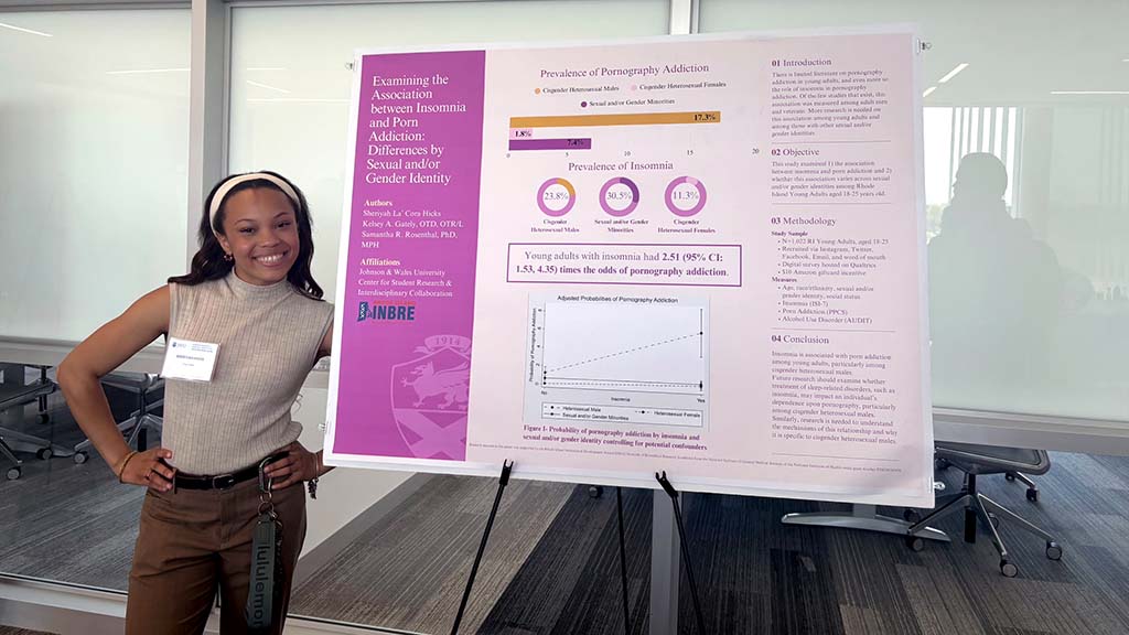 Sheriyah “Cora” Hicks with her poster presentation at the 2025 Student Research, Design &amp; Innovation Symposium. 