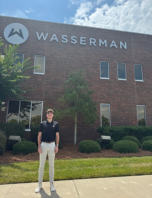 Ben Gill in front of the Wasserman building in Charlotte