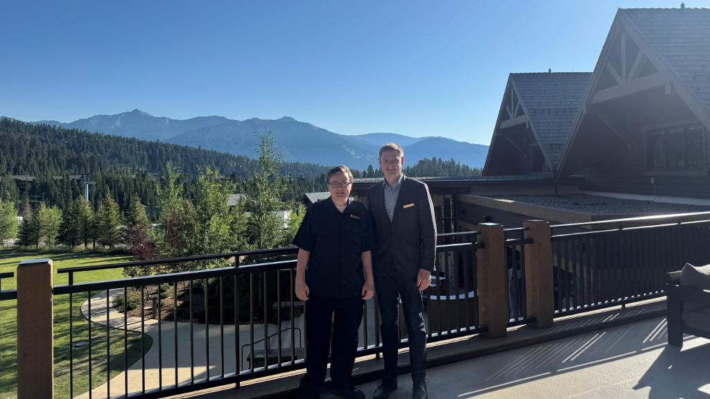 Caleb Risher '26 and Breandan Aslin '16 in front of Montage Big Sky