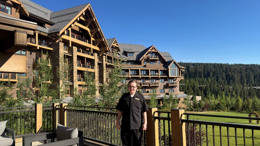 Caleb Risher '26 in front of Montage Big Sky