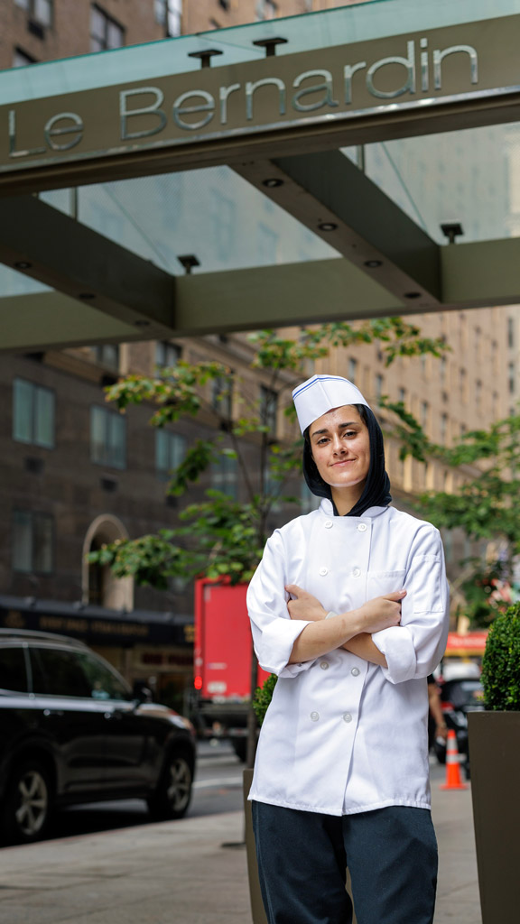 photo of Fatima Khan '27 posing in front of Le Bernardin