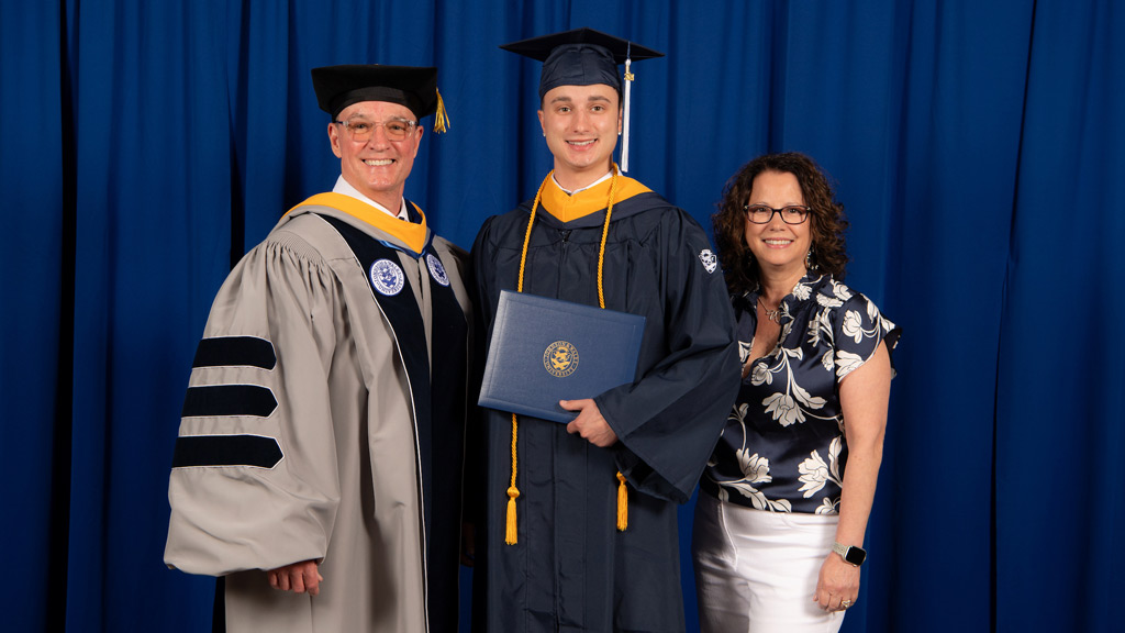 President Greene and his wife pose with their graduating son Jesse Joseph Greene '24