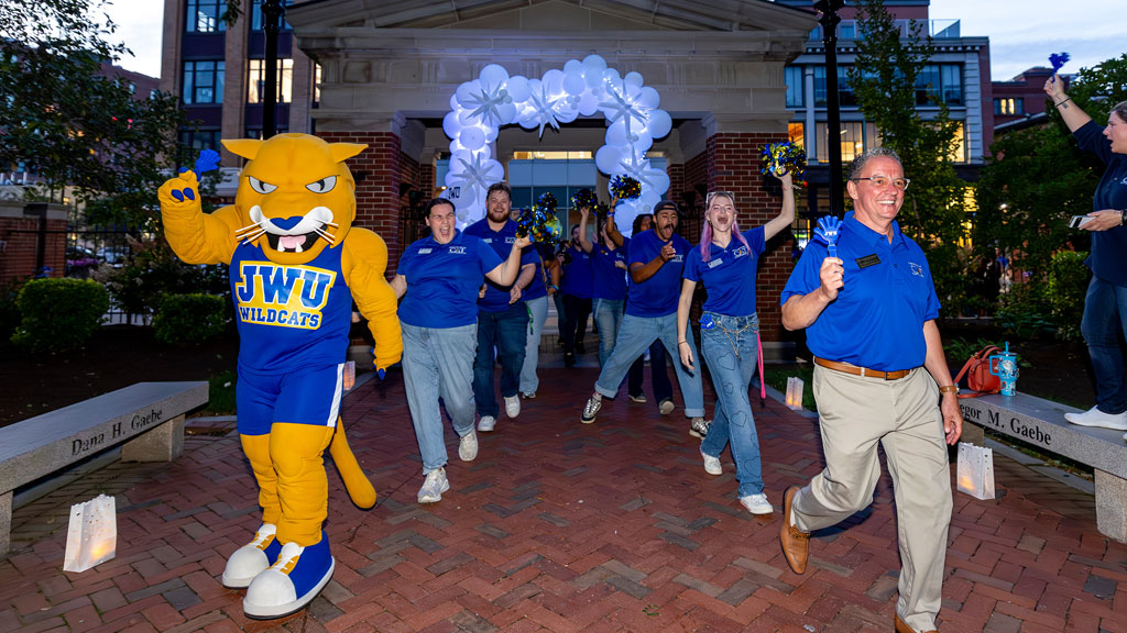 Providence Campus President Joe Greene celebrates with students at Ignite the Night