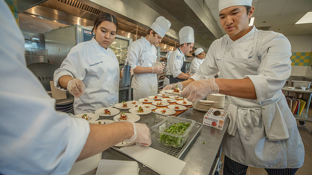 Students plating food