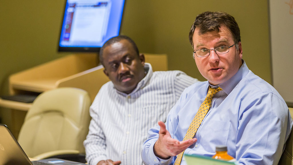 Grad students during a classroom session. 