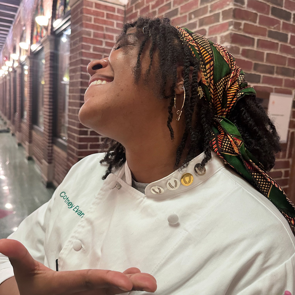 Courtney Evans and her Pins of Excellence