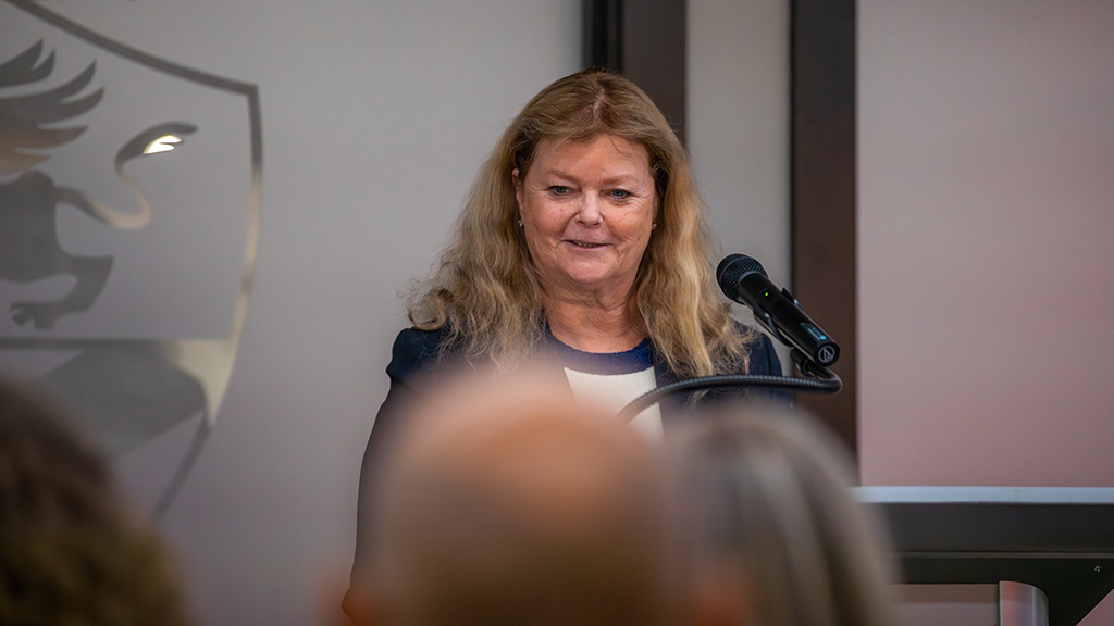 College of Health & Wellness Dean Maura Daly Iversen speaks at a podium
