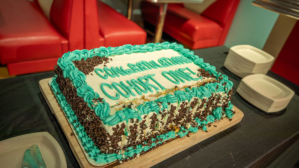"Congratulations cohort one!" cake for JWU's MSCND program grads