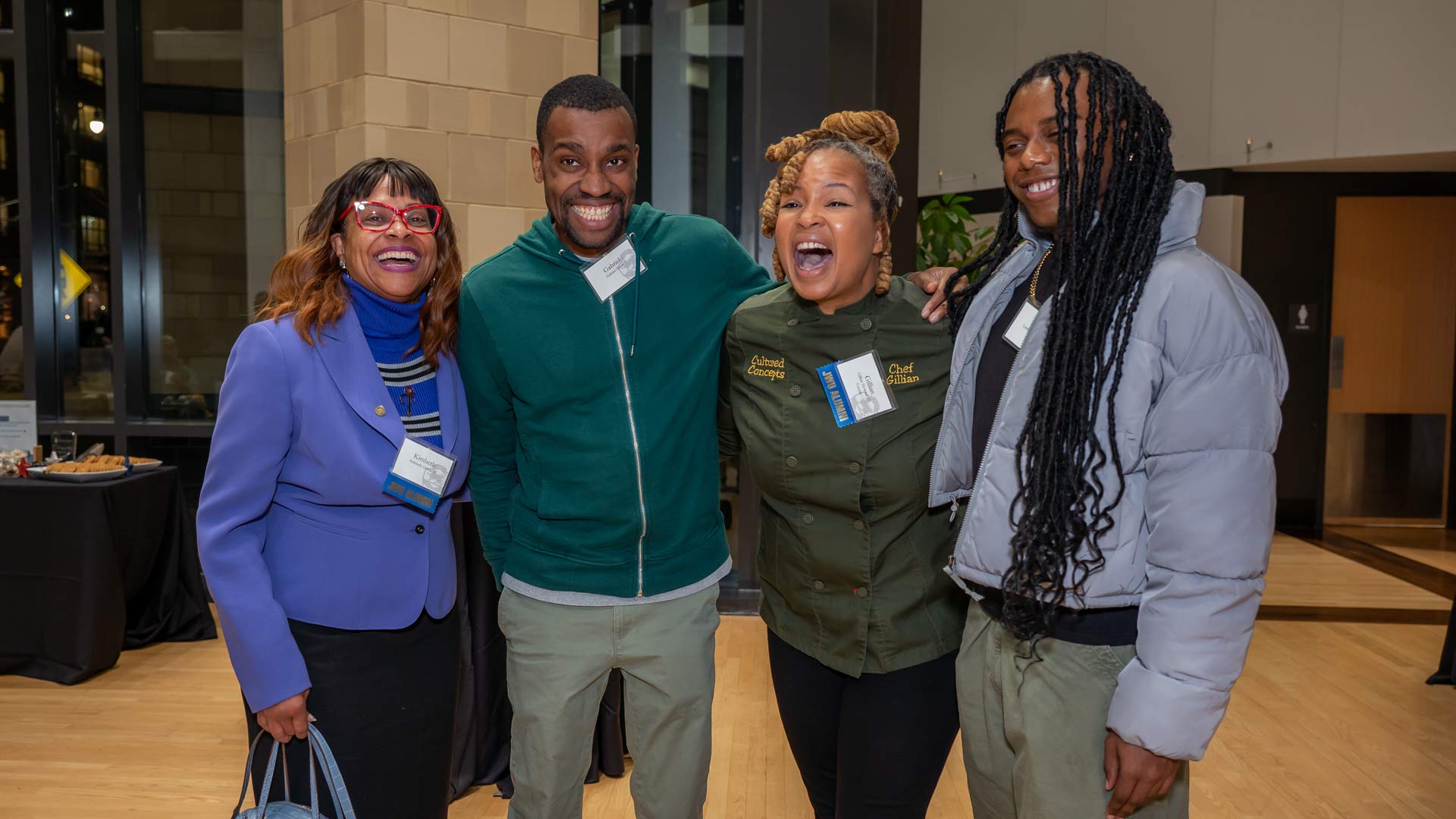 JWU Charlotte Veterans Day event speaker Gillian Howard '20 poses with three attendees