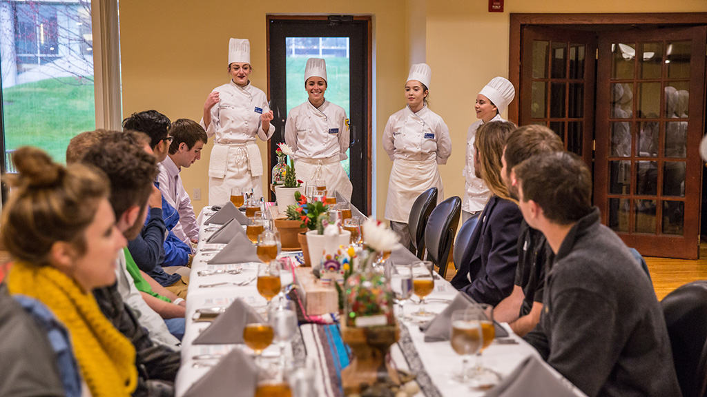 Culinary students presenting pop up concept to fellow students