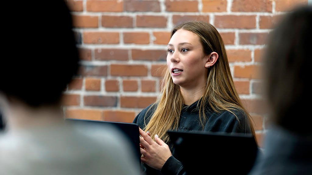 candid photo of a female student speaking